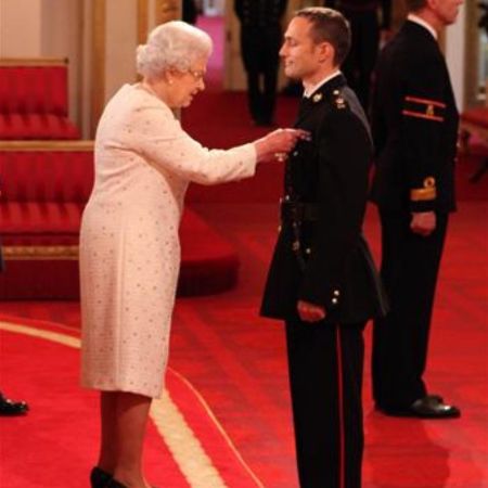 Niki Richard Dalgliesh Cavill awarded by the late Queen of England